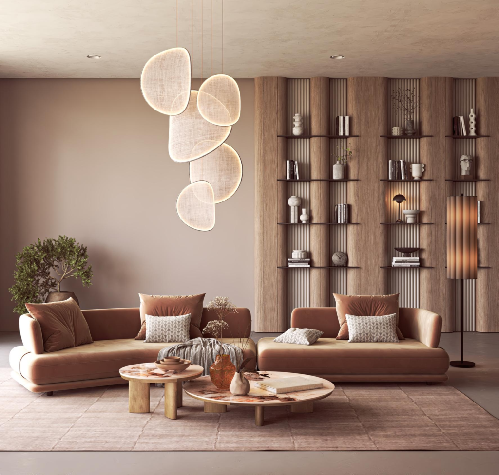 Warm minimalist living room with terracotta-toned sofas, sculptural pendant lighting, textured wood shelving, and layered neutral decor reflecting 2026 interior design trends.